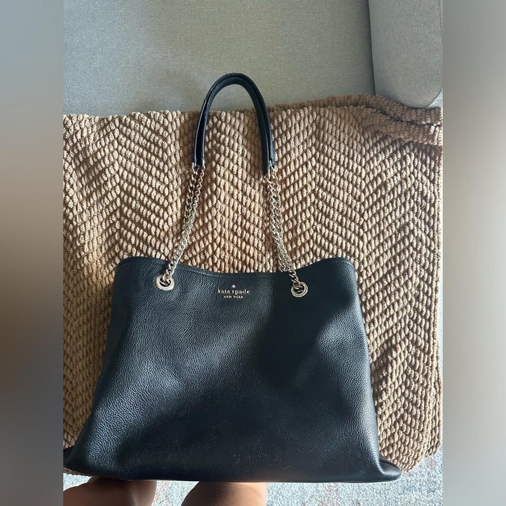 Kate Spade black purse with gold chain straps. Worn but in good condition